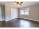 Bedroom featuring hardwood floors, closet, and window at 3844 Davis St, Suwanee, GA 30024