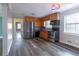 Eat-in kitchen featuring modern appliances, wood cabinets, and durable floors at 3844 Davis St, Suwanee, GA 30024