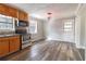 Kitchen features modern appliances, wood cabinets, and durable floors at 3844 Davis St, Suwanee, GA 30024