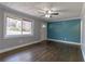 Living room with hardwood floors, neutral paint, and lots of natural light at 3844 Davis St, Suwanee, GA 30024