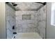 Bathroom showing shower with marble tiles and black hardware at 3844 Davis St, Suwanee, GA 30024