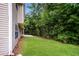 Well-maintained backyard features a lawn with lush greenery and a patio area at 4530 Talon Way, Douglasville, GA 30135
