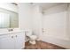 Bright bathroom featuring a single sink vanity, toilet, and a shower-tub combination at 4530 Talon Way, Douglasville, GA 30135