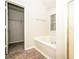 Bathroom featuring a soaking tub with a window, a shower, and a walk-in closet at 4530 Talon Way, Douglasville, GA 30135