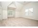 Bright bedroom with an angled ceiling, a large window, and neutral carpeting at 4530 Talon Way, Douglasville, GA 30135
