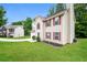 Manicured lawn with a two-story home featuring neutral siding and brick details at 4530 Talon Way, Douglasville, GA 30135