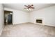 Spacious living room with plush carpet, fireplace and adjoining kitchen access at 4530 Talon Way, Douglasville, GA 30135