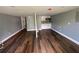 Spacious basement with new hardwood floors and a kitchenette, perfect for entertaining guests at 5191 Nw Emory Nw St, Covington, GA 30014