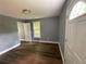 Bedroom with wood-look floors, natural light from a window, and modern ceiling light at 5191 Nw Emory Nw St, Covington, GA 30014