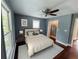 Bedroom with dark walls, ceiling fan, and closet at 5191 Nw Emory Nw St, Covington, GA 30014