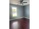 Bedroom featuring wood floors, neutral walls and ample sunlight at 5191 Nw Emory Nw St, Covington, GA 30014