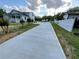 Long driveway leads to a charming two-story home with inviting front porch at 5191 Nw Emory Nw St, Covington, GA 30014