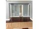Spacious, unfinished room with hardwood floors and multiple doorways, ready for customization at 5191 Nw Emory Nw St, Covington, GA 30014