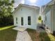 Exterior view of detached building with a side entrance, stone walkway and manicured lawn at 5191 Nw Emory Nw St, Covington, GA 30014