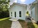 The exterior of the light blue siding features a new patio and well-maintained landscaping at 5191 Nw Emory Nw St, Covington, GA 30014