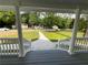 Inviting front porch with serene views of the neighborhood, enhancing the home's charm at 5191 Nw Emory Nw St, Covington, GA 30014