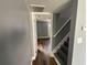 Hallway featuring sleek, dark wood floors leading to a bright, open room at 5191 Nw Emory Nw St, Covington, GA 30014
