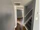 Inviting hallway with gray walls and dark wood-look flooring leading to a staircase at 5191 Nw Emory Nw St, Covington, GA 30014
