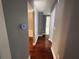 Long hallway with hardwood floors that connect various rooms at 5191 Nw Emory Nw St, Covington, GA 30014