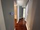 Hallway featuring hardwood floors and gray walls at 5191 Nw Emory Nw St, Covington, GA 30014