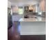 Spacious kitchen featuring an island, white cabinets, and stainless steel refrigerator at 5191 Nw Emory Nw St, Covington, GA 30014