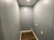 Functional laundry room with dark wood-look flooring and hookups at 5191 Nw Emory Nw St, Covington, GA 30014