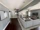 Open-concept living room featuring hardwood floors, modern decor, and seamless flow to the kitchen at 5191 Nw Emory Nw St, Covington, GA 30014