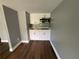 Modern kitchenette with white cabinets, stainless steel microwave, and granite countertops at 5191 Nw Emory Nw St, Covington, GA 30014