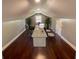 A finished attic space has been transformed to an office with hardwood floors and natural light at 5191 Nw Emory Nw St, Covington, GA 30014