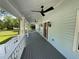 Spacious covered porch featuring ceiling fans and a relaxing outdoor living space at 5191 Nw Emory Nw St, Covington, GA 30014