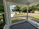 Cozy porch with white railings providing a comfortable outdoor space and neighborhood view at 5191 Nw Emory Nw St, Covington, GA 30014