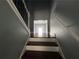 View of the home staircase with modern railing and grey walls leading to an upper level of the home at 5191 Nw Emory Nw St, Covington, GA 30014