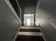 A stairway with paneled walls, leading to a bright hallway, showcasing the home's entrance at 5191 Nw Emory Nw St, Covington, GA 30014
