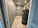 Utility room featuring shelving and a hot water heater at 5191 Nw Emory Nw St, Covington, GA 30014