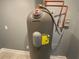 Marathon water heater and plumbing with copper pipes and wood-look flooring at 5191 Nw Emory Nw St, Covington, GA 30014
