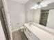 Bathroom with a long white vanity, gray tile flooring, and a glass-enclosed shower at 108 Hickory Run, Canton, GA 30115