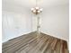 Bedroom with hardwood floors, base trim, double doors and a view into the hallway at 108 Hickory Run, Canton, GA 30115