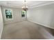 Dining room featuring carpet, two windows and a chandelier at 108 Hickory Run, Canton, GA 30115