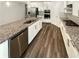 Modern kitchen featuring stainless steel appliances, granite countertops, and an island sink at 108 Hickory Run, Canton, GA 30115