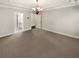A clean and bright main bedroom with new carpet, a modern light fixture, and neutral paint at 108 Hickory Run, Canton, GA 30115