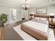 Spacious, virtually staged main bedroom with a large bed, modern furniture, and an ensuite bathroom at 108 Hickory Run, Canton, GA 30115