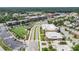 Aerial view of community with landscaped green spaces, parking, and commercial buildings at 1210 Mayfield Rd, Milton, GA 30009
