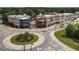 Commercial real estate with roundabout, outdoor seating, and diverse architecture at 1210 Mayfield Rd, Milton, GA 30009