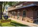 Charming brick commercial building with arched windows, 'Dentistry' signage, and athletic club at 1210 Mayfield Rd, Milton, GA 30009
