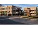 Commercial brick building with large windows and metal staircase, featuring outdoor dining at 1210 Mayfield Rd, Milton, GA 30009