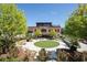 Inviting outdoor area with artificial turf, patio, and lush landscaping, perfect for relaxation at 1210 Mayfield Rd, Milton, GA 30009