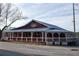 Acre Bar & Grill's exterior boasts covered patio and ample parking for a cozy dining experience at 1210 Mayfield Rd, Milton, GA 30009