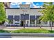 Charming restaurant exterior with a brick facade, stylish awnings, and outdoor seating area at 1210 Mayfield Rd, Milton, GA 30009