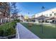 Picturesque view of the Town Green, featuring open green space, casual seating, and retail storefronts at 1210 Mayfield Rd, Milton, GA 30009