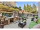 Inviting back patio with stone fireplace, outdoor seating and mounted television at 1345 Hilltop Overlook Dr, Marietta, GA 30062